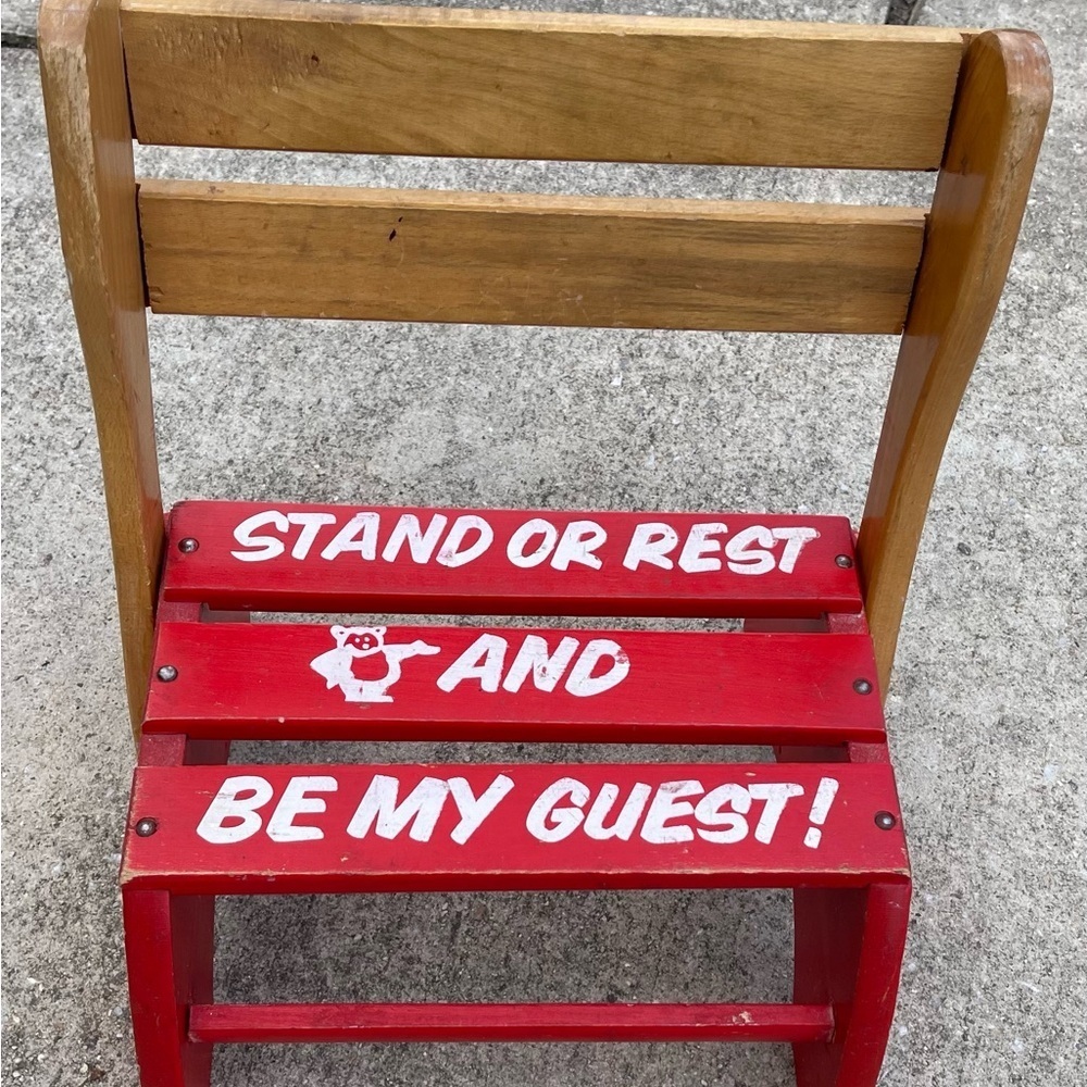 Red Wooden Chair with White Text